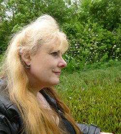 Portrait of young woman in grass