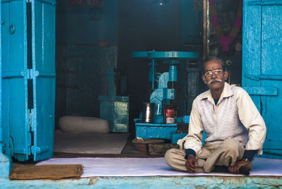 Portrait of man sitting on chair