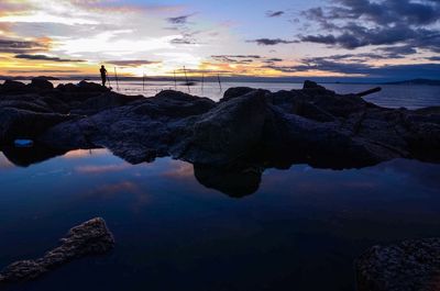 View of calm sea against scenic sky