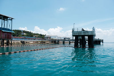 View of swimming pool in sea against sky