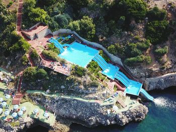 High angle view of swimming pool by building
