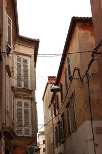 Low angle view of buildings against clear sky