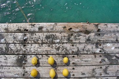 Yellow painted on wooden floor against wall