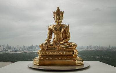 Low angle view of statue against sky