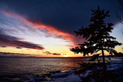 Scenic view of sea against sky at sunset