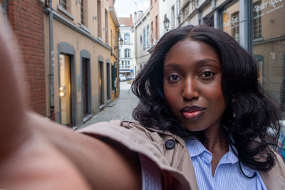 Portrait of young woman looking away