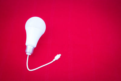 Directly above shot of pink art on white background