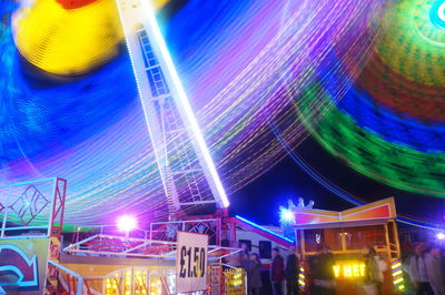 Low angle view of illuminated lights at night