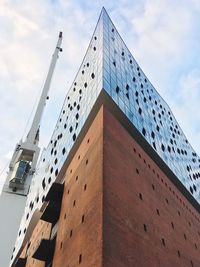 Low angle view of modern building against sky
