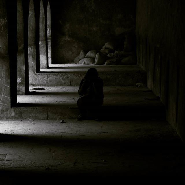 indoors, built structure, architecture, full length, sitting, abandoned, old, rear view, silhouette, old ruin, window, history, dark, men, steps, lifestyles, leisure activity, wall - building feature