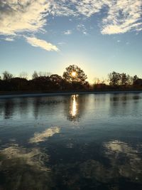 Scenic view of lake against sky during sunset