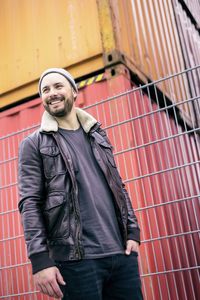 Portrait of smiling man standing outdoors