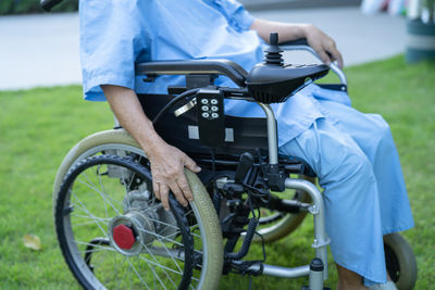 Midsection of man riding bicycle