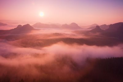 Scenic view of mountains against sky during sunset