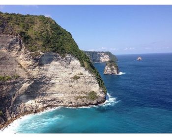 Scenic view of sea against blue sky