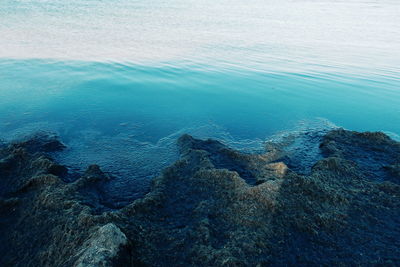 Scenic view of sea against blue sky