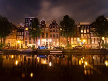 Reflection of illuminated buildings in canal at night