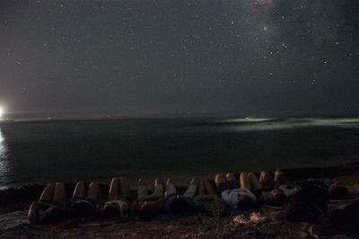 Scenic view of sea against sky at night
