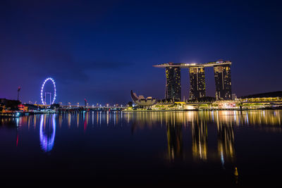 Reflection of illuminated buildings in water at night