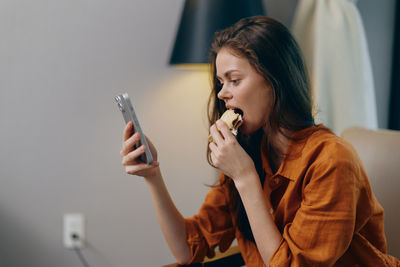 Young woman using mobile phone