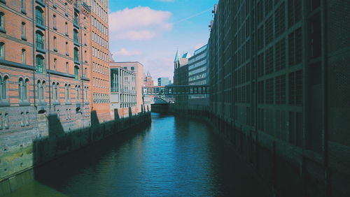 View of river in city against sky