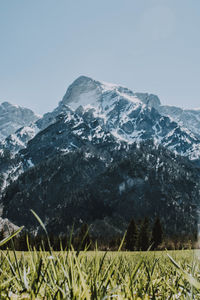 Scenic view of snowcapped mountains against clear sky