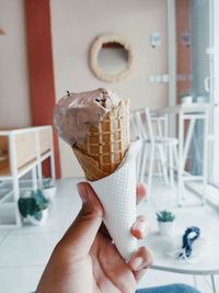 Cropped hand of person holding ice cream