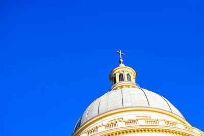 Low angle view of a building against blue sky