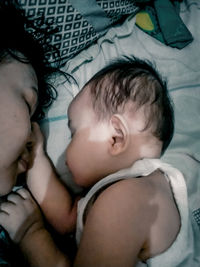 Portrait of cute boy sleeping on bed