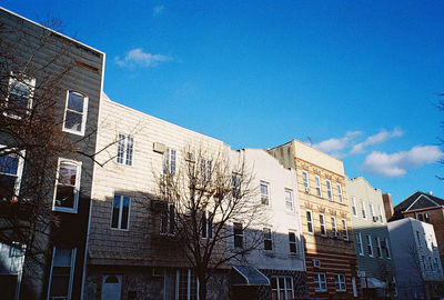 Low angle view of building against blue sky