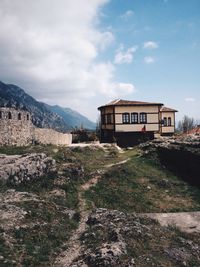 Built structures against mountain range