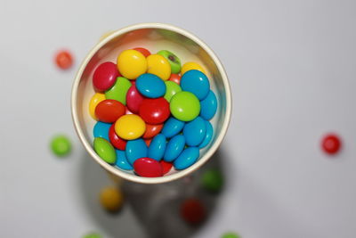 High angle view of multi colored candies in bowl