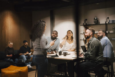 Coworkers having meeting in office