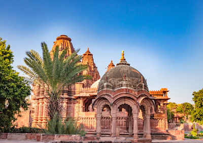 Ancient hindu temple architecture with bright blue sky from unique angle at day shot