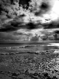 Scenic view of sea against storm clouds
