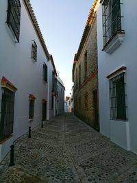 Street amidst buildings against sky