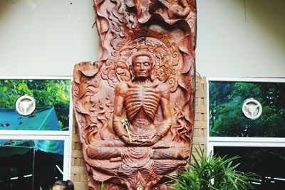 Close-up of statue against building