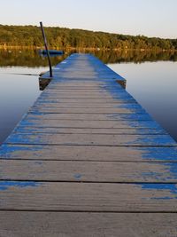 Pier over lake against sky