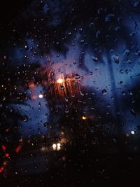 Full frame shot of wet car window