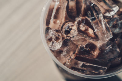 Close-up of ice cream in glass on table