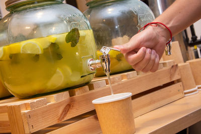 Close-up of hand holding glass of table