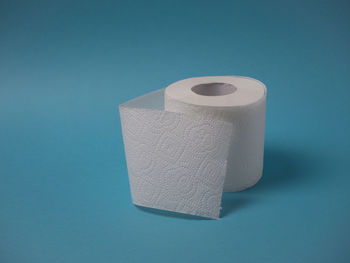 High angle view of paper against blue background