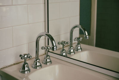 Close-up of faucet in bathroom