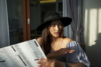 Young woman reading book