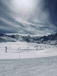 Scenic view of snow mountains against sky