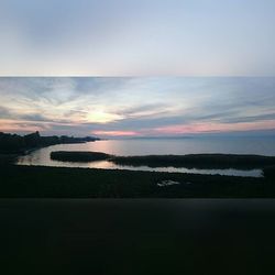 Scenic view of sea at sunset