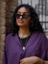 Portrait of beautiful young woman wearing sunglasses