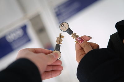 Close-up of hands holding keys