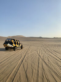 Scenic view of desert against clear sky