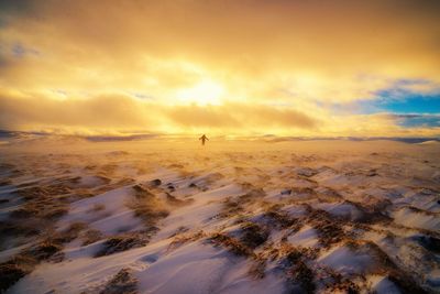 Scenic view of landscape against cloudy sky